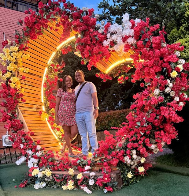 Brian and Angella inside an illuminated floral heart