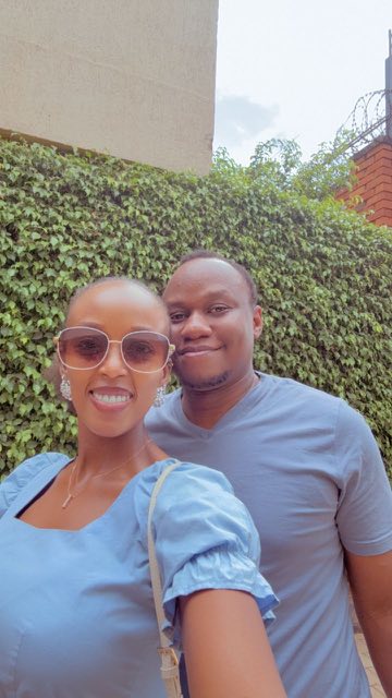 Brian and Angella in front of a green ivy wall